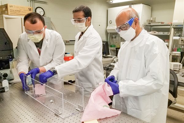 Saif and his students in the lab.