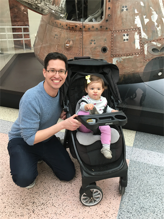 Photo of Josh Sulkin and his daughter in front of a Spacecraft